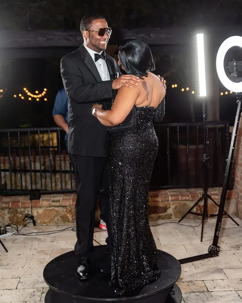 Couple on 360° platform at night gala event